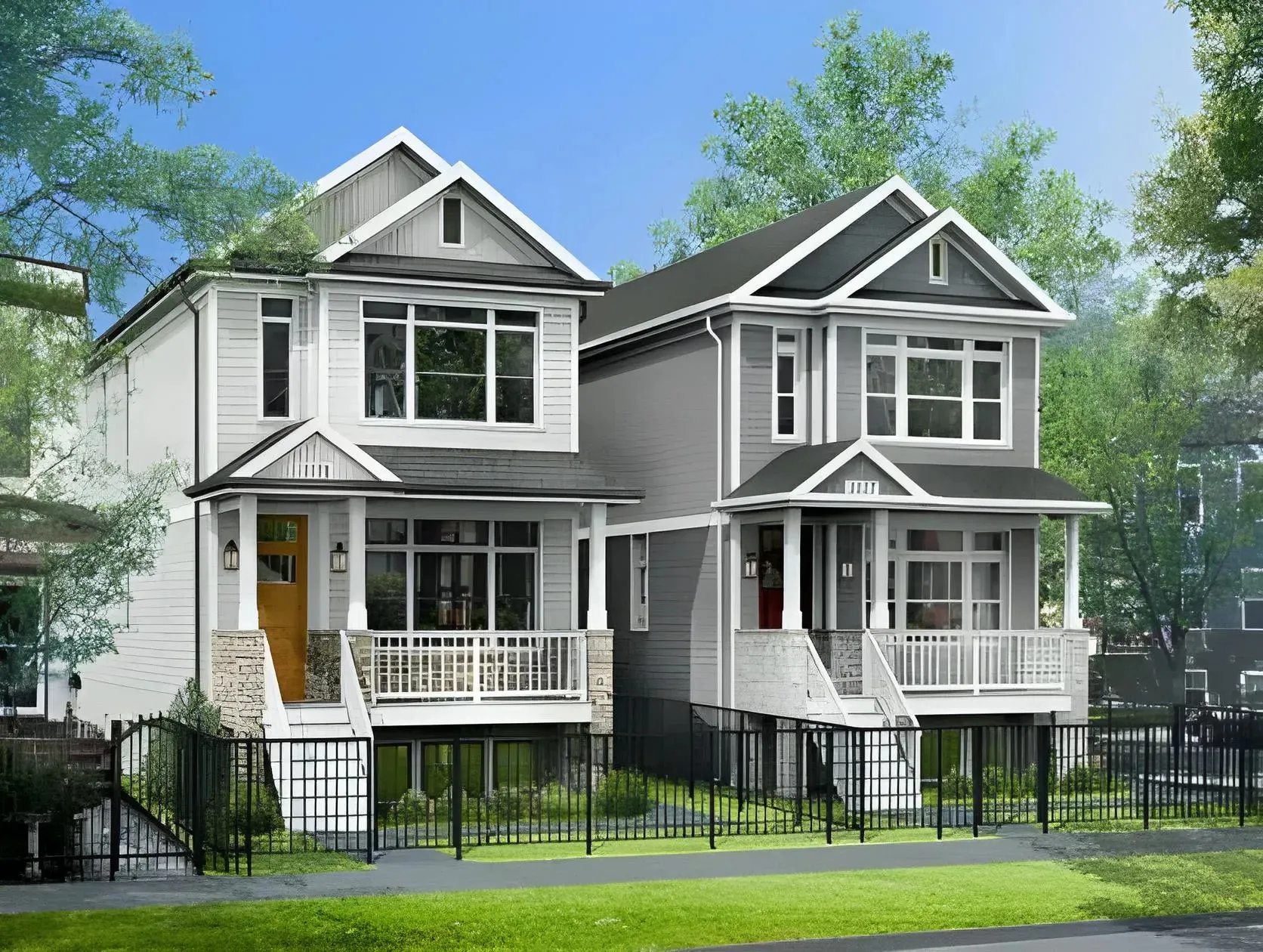 A pair of modern two-story houses with gray and white exteriors are shown side by side. Each house features large windows, front porches, and a small lawn area enclosed by a black metal fence. Green trees and a sidewalk are visible in the background.